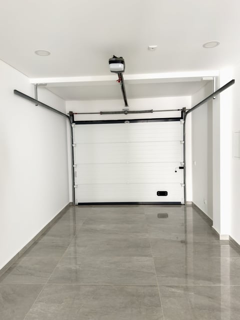 Modern garage with polished gray tiled flooring